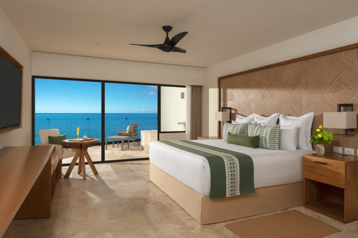 Club Master Suite Ocean Front King bedroom with private balcony and Caribbean Sea views at Dreams Sapphire Resort & Spa.