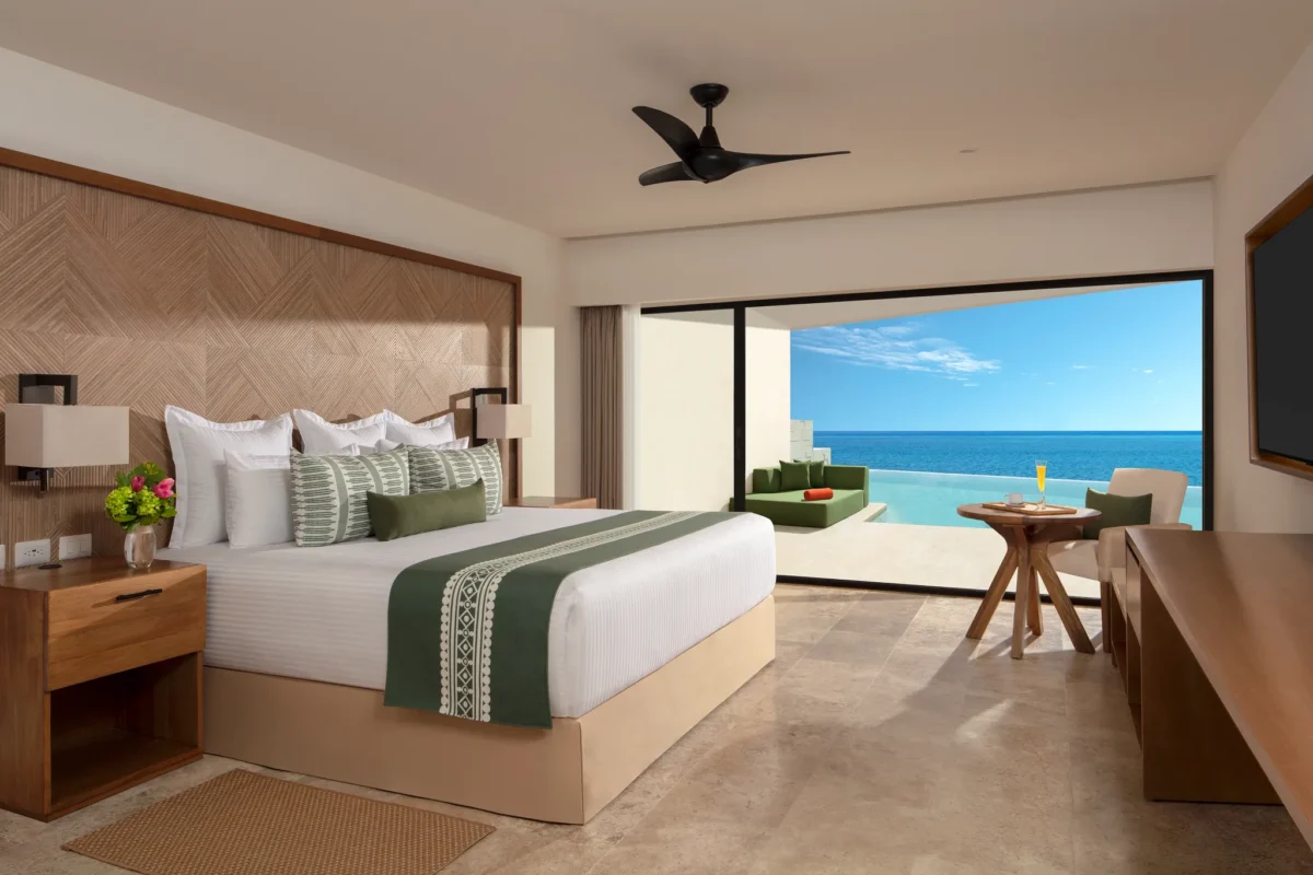 Club Master Suite Ocean Front Swim Out King with private terrace, pool access, and Caribbean Sea views at Dreams Sapphire Resort & Spa.