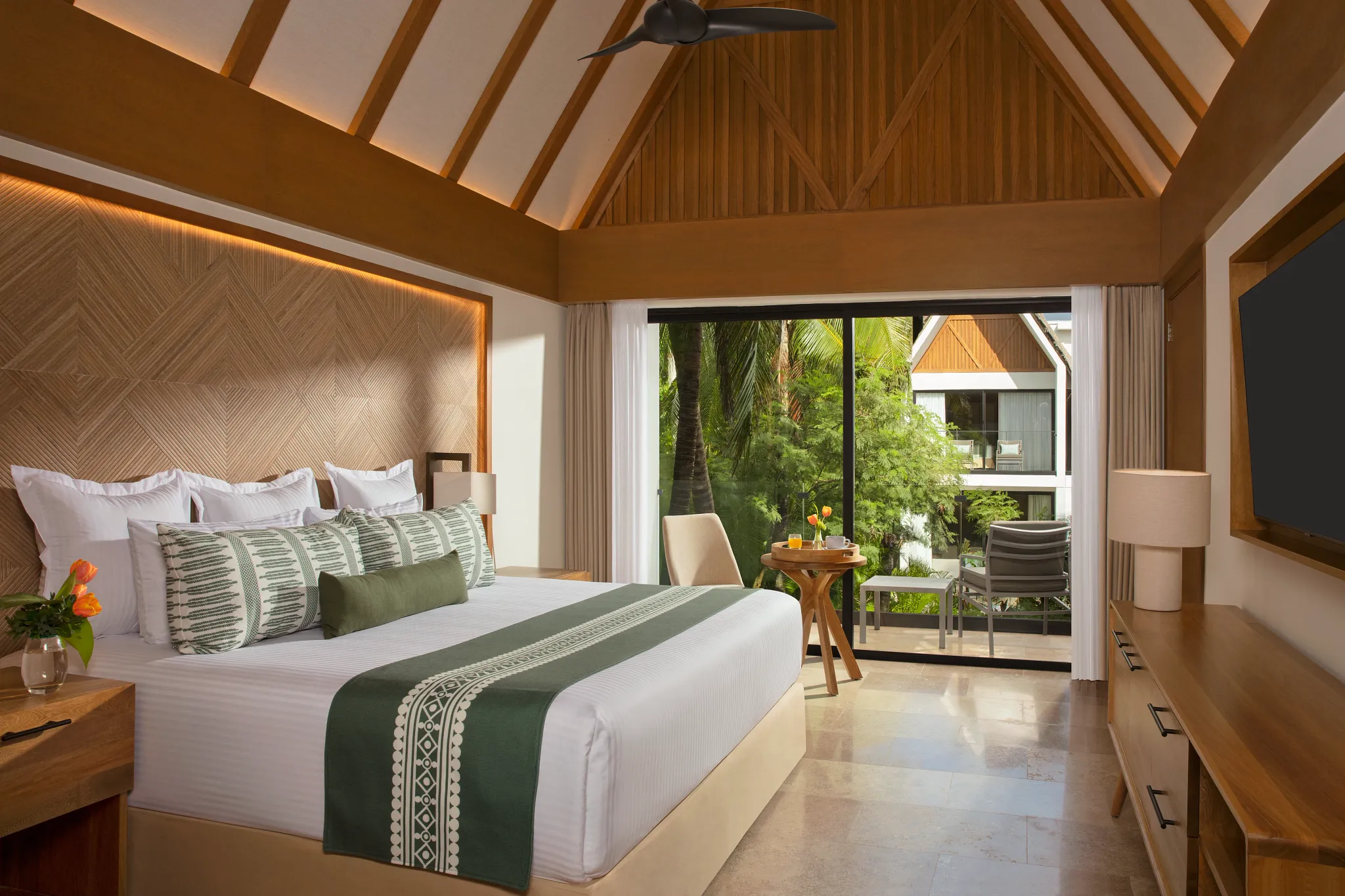 Club Two-Story Villa king bedroom with tropical garden views at Dreams Sapphire Resort & Spa.