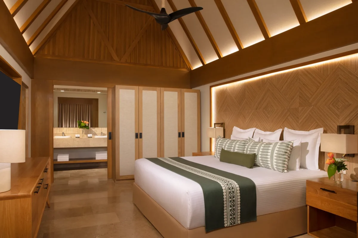Club Two-Story Villa second bedroom with two double beds and tropical garden views at Dreams Sapphire Resort & Spa.