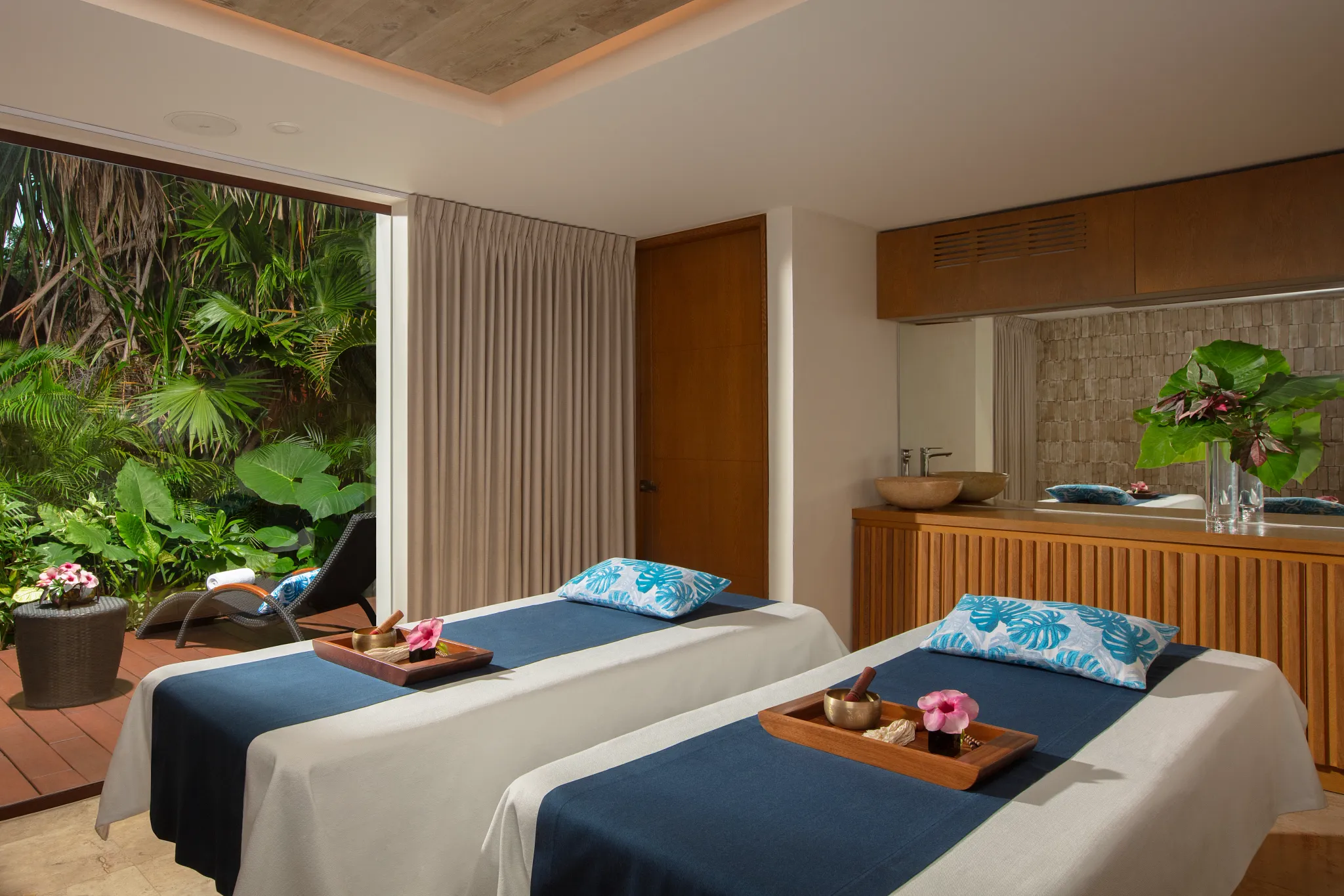 Private couples massage suite surrounded by tropical gardens at Dreams Sapphire Resort & Spa.