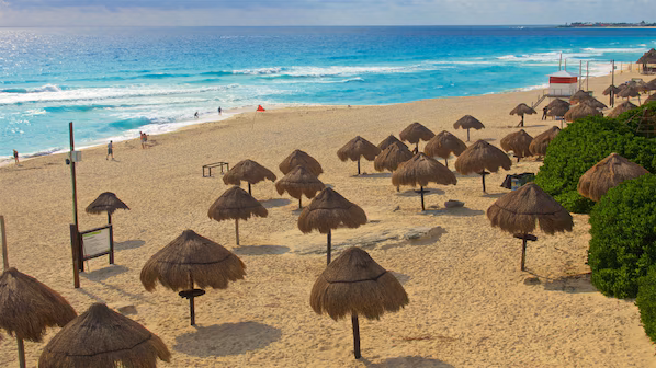 Delfines Beach near Dreams Sapphire Resort & Spa with iconic white sands, turquoise waters, and panoramic Caribbean views