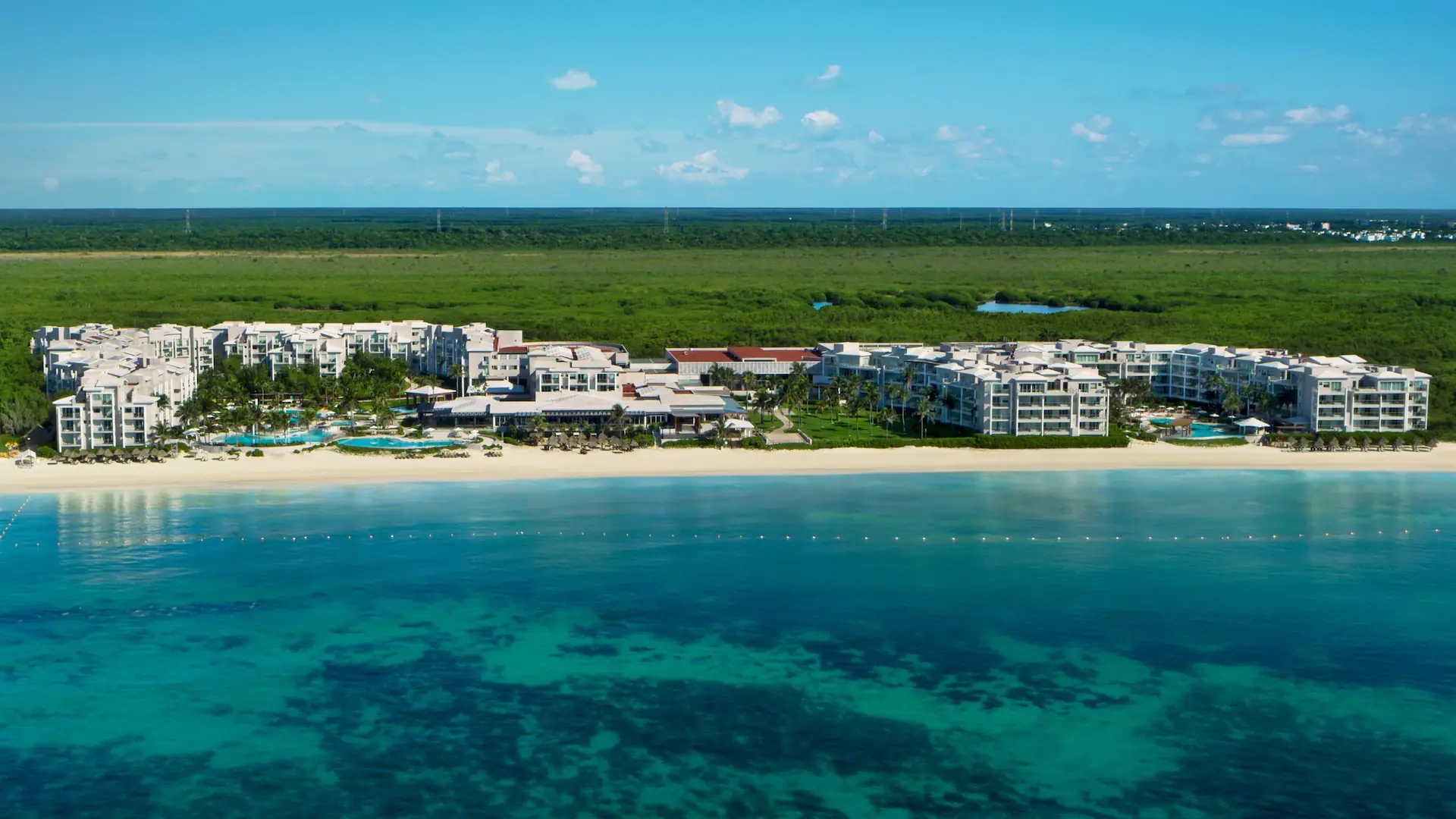 Dreams Jade Resort and Spa all-inclusive beachfront resort with pools and modern accommodations in Puerto Morelos.