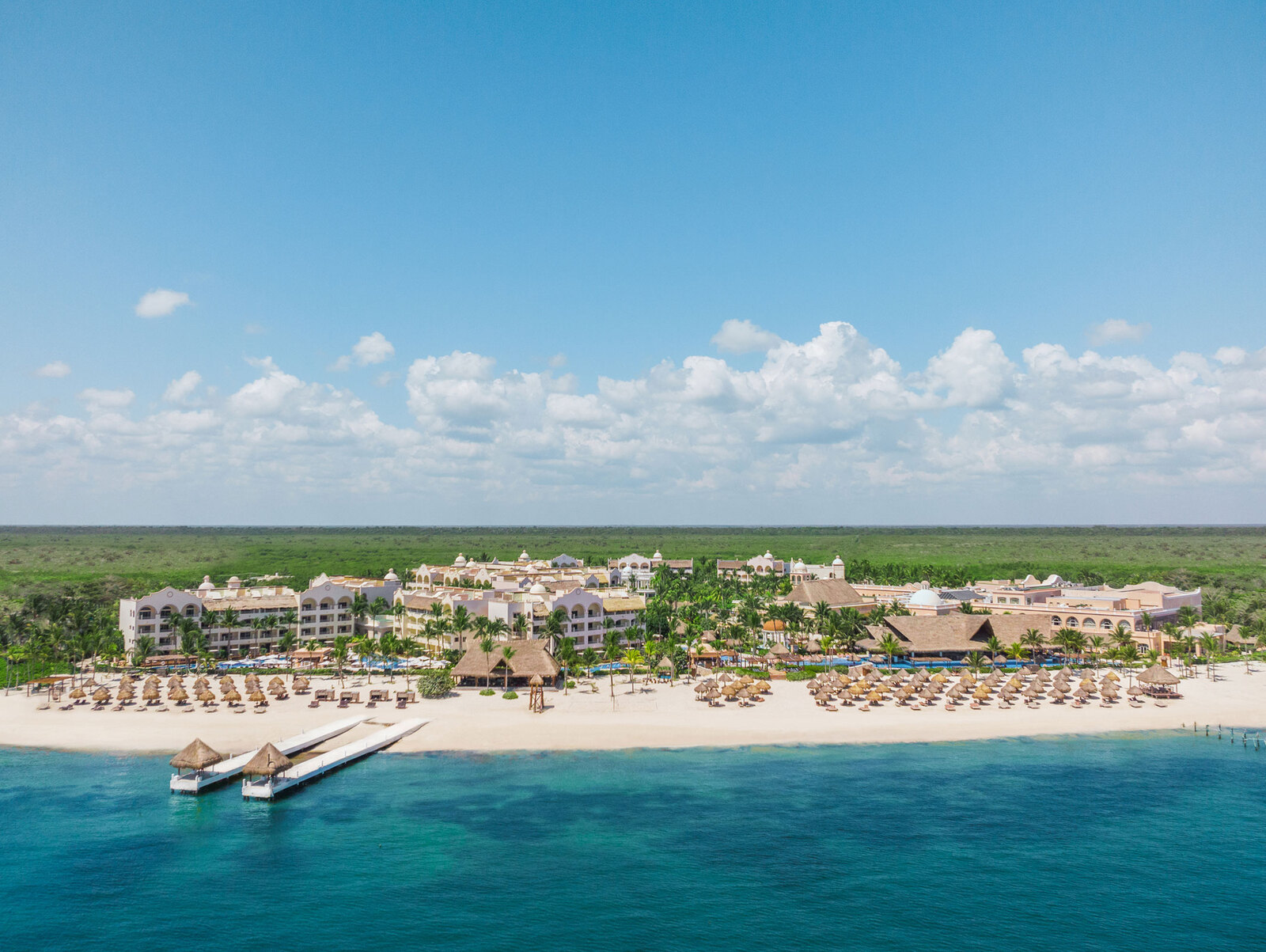 Excellence Riviera Cancun adults-only luxury all-inclusive resort with beachfront suites, swim-up pools, and romantic ambiance in Riviera Maya.