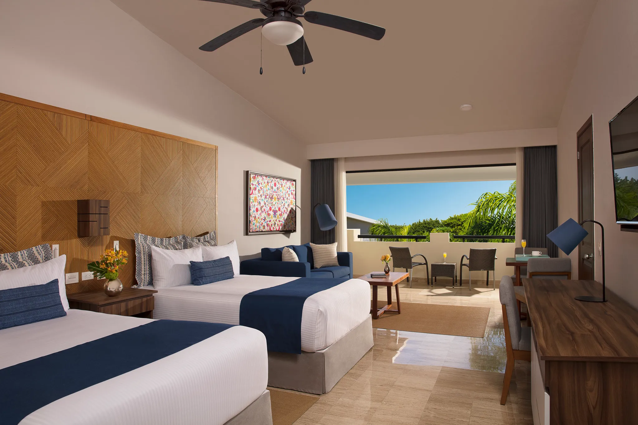 Family Junior Suite Tropical View with two double beds and private balcony at Dreams Sapphire Resort & Spa.