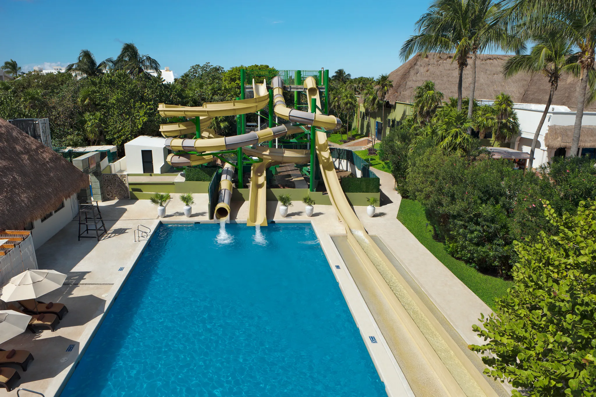 Large multi-slide water attraction at Dreams Sapphire Resort & Spa designed for family fun and adventure.