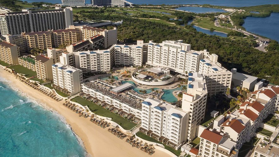 Hilton Cancun all-inclusive beachfront resort with modern architecture, pools, and ocean views near Cancun, Mexico.