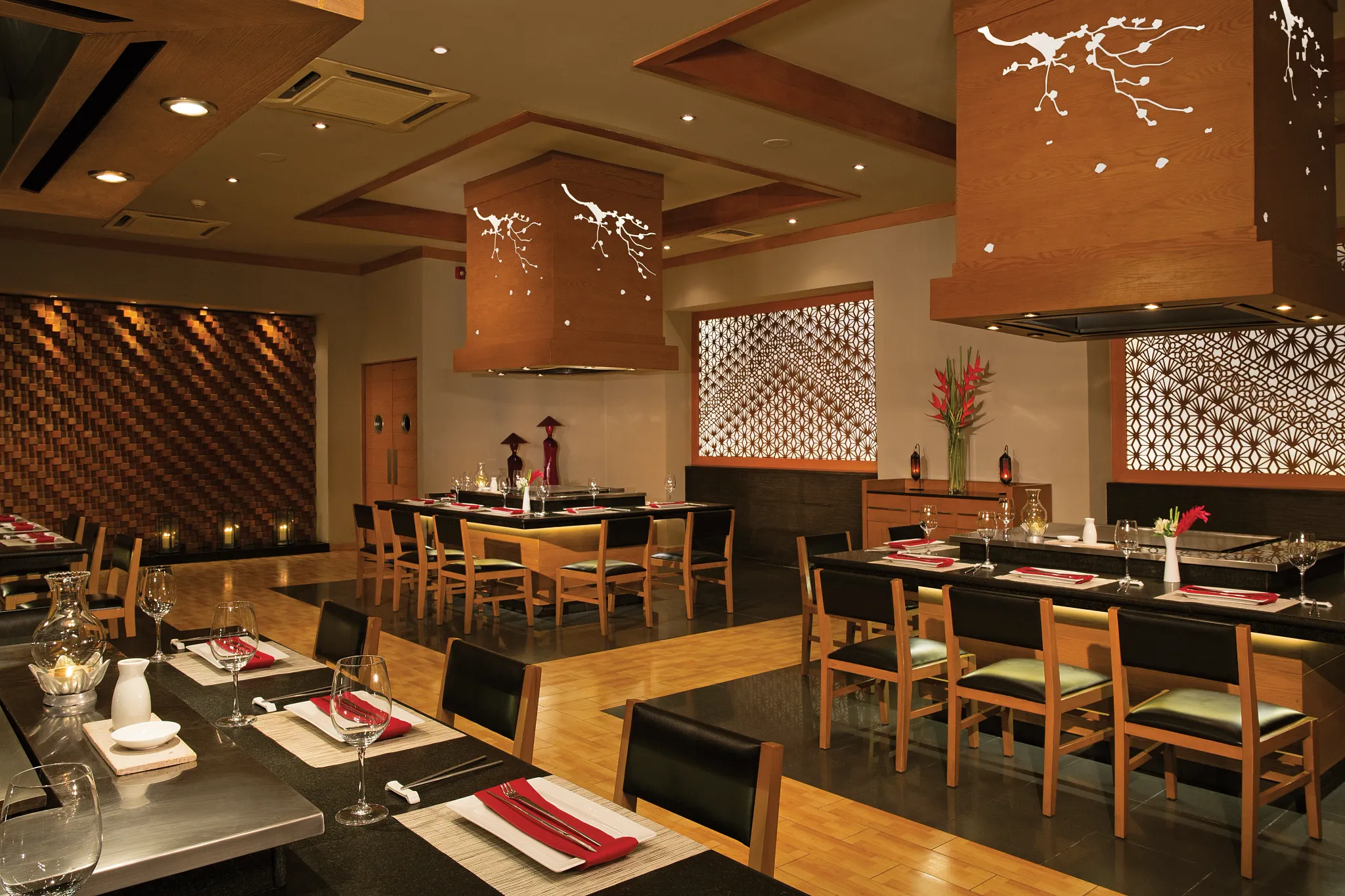 Himitsu at Dreams Sapphire Resort & Spa featuring contemporary Asian-inspired décor, teppanyaki tables, and authentic Pan-Asian cuisine.