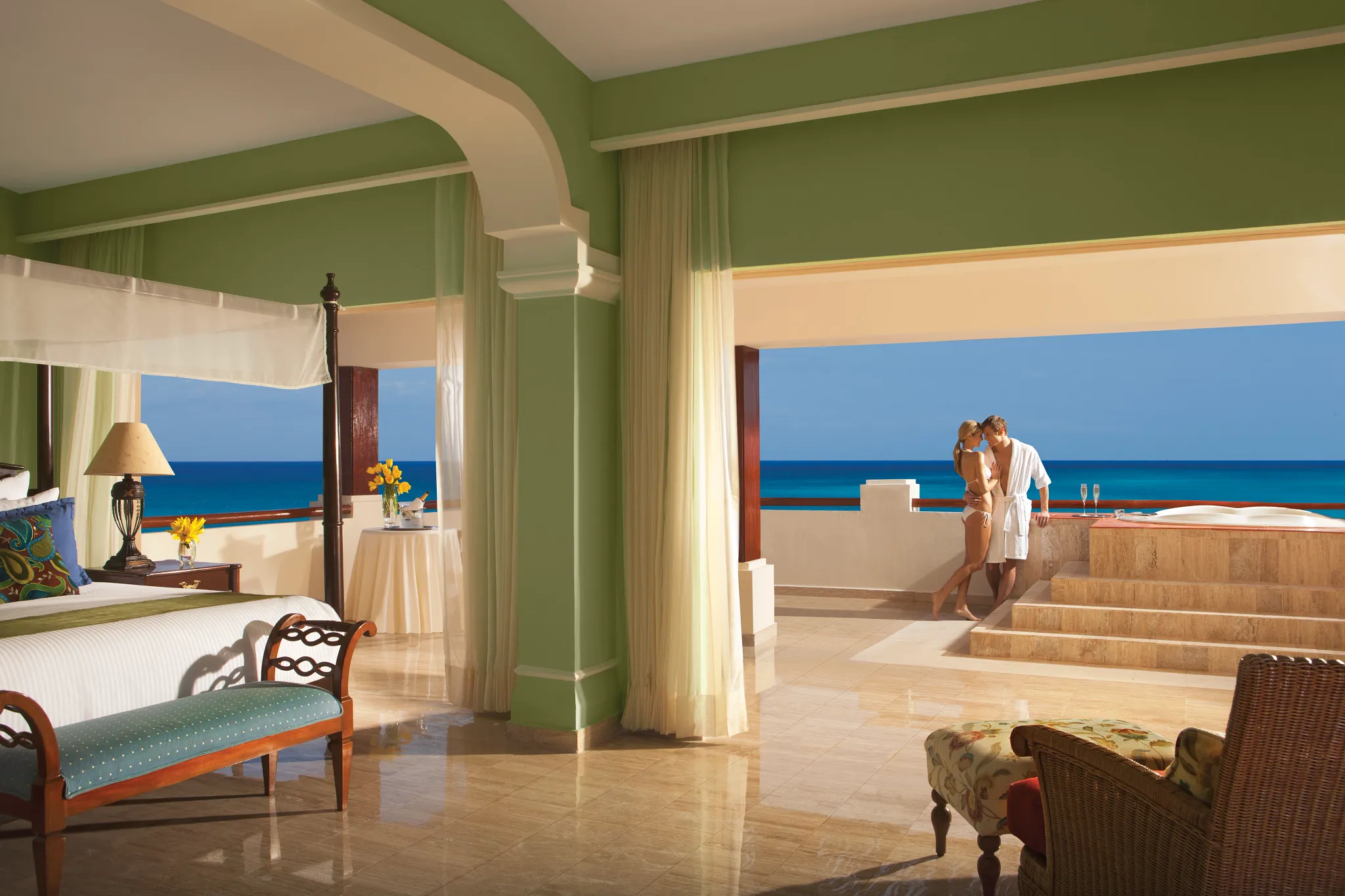 Preferred Club Governor Suite with king bed, living area, oceanfront terrace, and outdoor hot tub at Dreams Sapphire Resort & Spa.