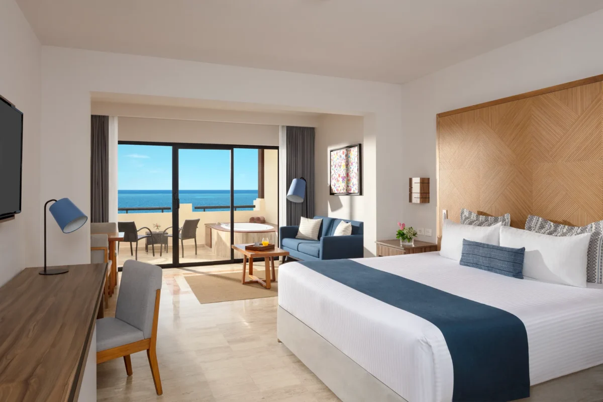 Preferred Club Junior Suite Ocean Front with king bed and oceanfront terrace at Dreams Sapphire Resort & Spa.