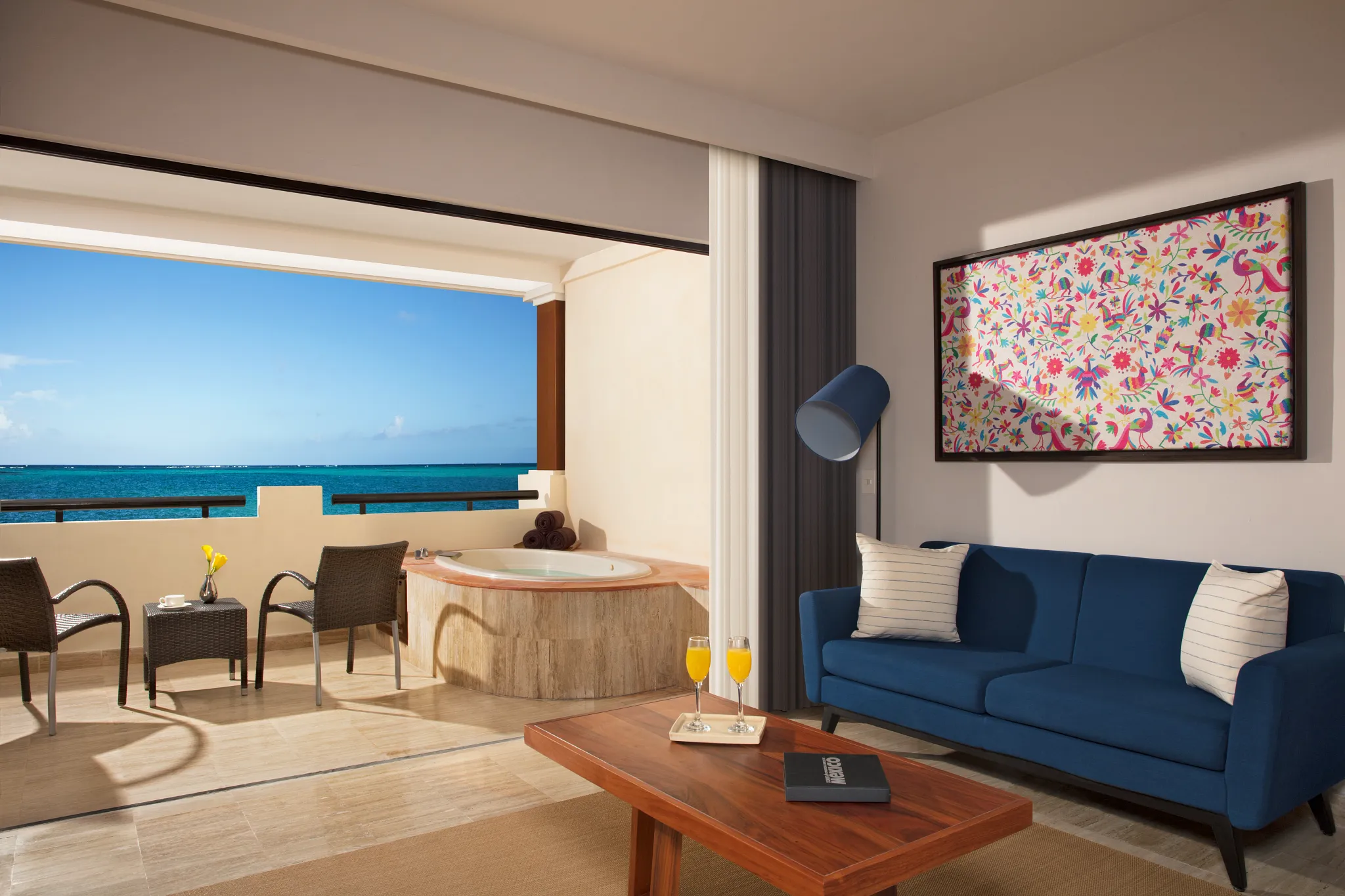 Preferred Club Junior Suite Ocean Front with king bed and oceanfront terrace at Dreams Sapphire Resort & Spa.