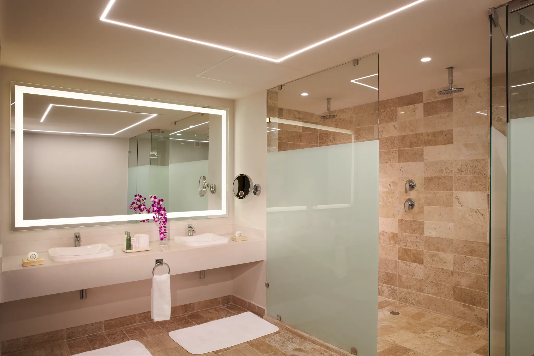 Preferred Club Master Suite Ocean Front bathroom with double vanity and walk-in shower at Dreams Sapphire Resort & Spa.