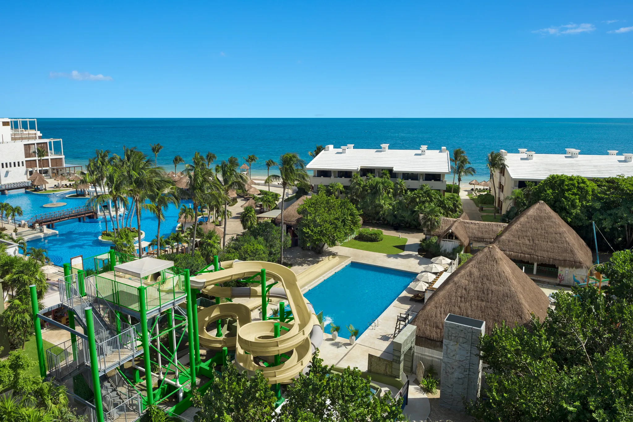 Waterslide complex near the main pool at Dreams Sapphire Resort & Spa offering exciting family-friendly attractions.