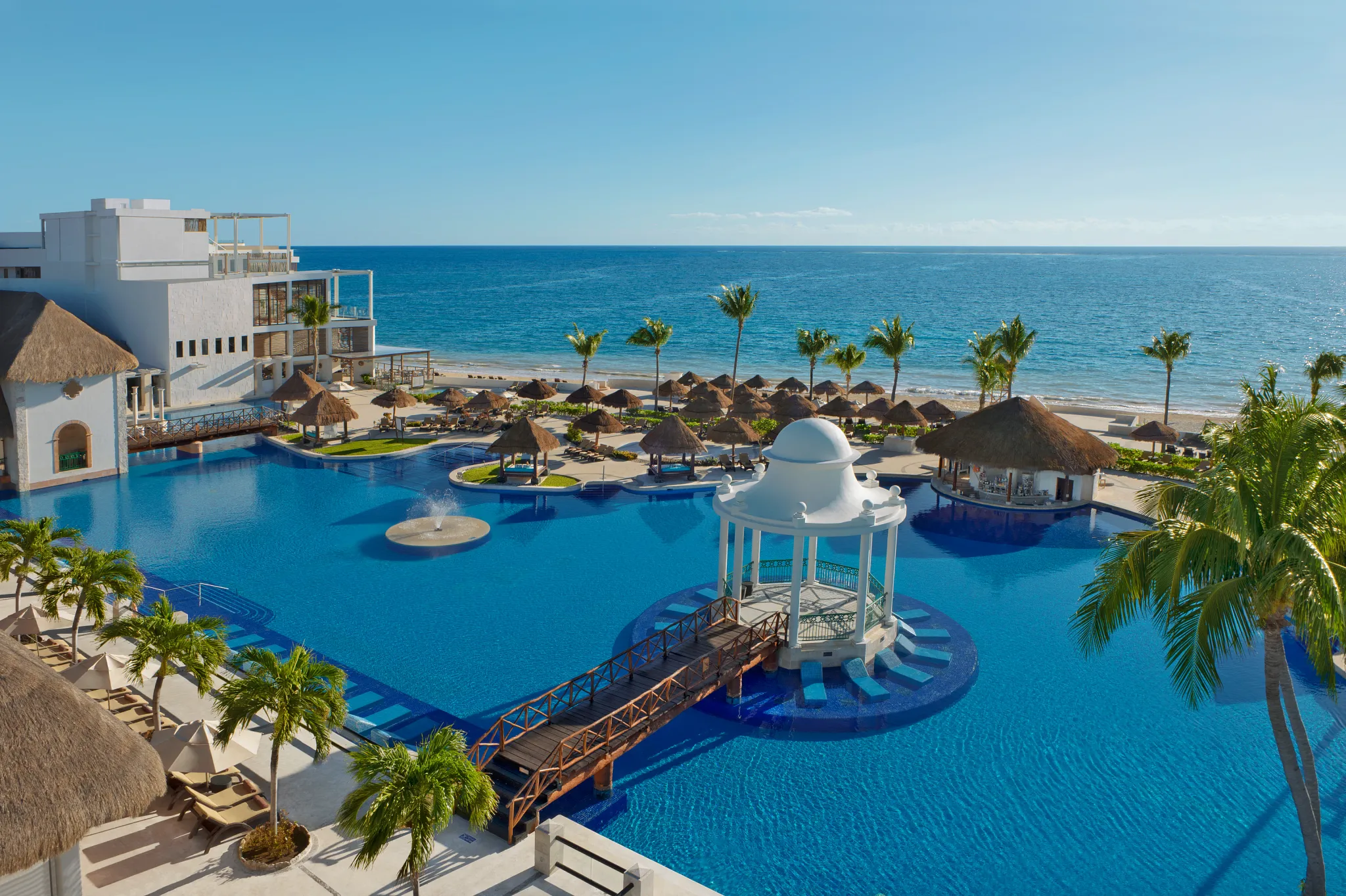 Sugar Reef at Dreams Sapphire Resort & Spa featuring a casual beachfront café with coffee, pastries, light snacks, and tropical resort views.
